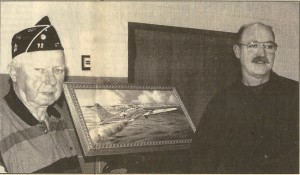 Al Broughton, left, and artist Les LeFevre stand next to LeFerve's painting portraying the last moments of Broughton's 35th mission as a tailgunner on the B-17 that crashed into the White Cliffs of Dover during World War II on Aug. 24, 1944.